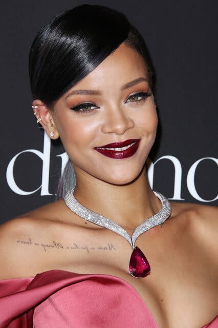 If you’re going for a super glam look, take a cue from Rihanna and match a dark, ruby red lip with some major jewelry (and maybe even your dress). 