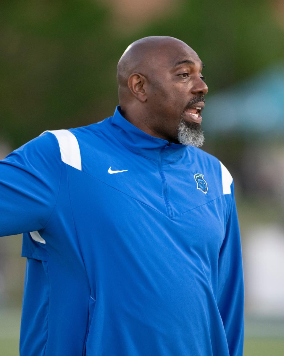 Coach Ron Dickerson communicates with the sideline during during a timeout in the spring football game at the University of West Florida in Pensacola on Thursday, April 14, 2022.