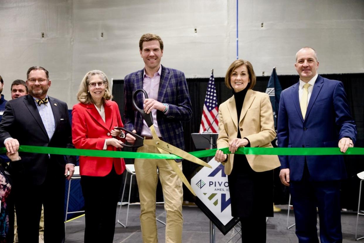 From left to right: Roger Underwood, Chairman of the Board of Directors at Pivot Bio; Wendy Wintersteen, President of Iowa State University; Chris Abbott, Pivot Bio CEO; Governor Kim Reynolds; and Iowa Secretary of Agriculture Mike Naig attend a ribbon-cutting for Pivot's new $14 million facility in Ames.