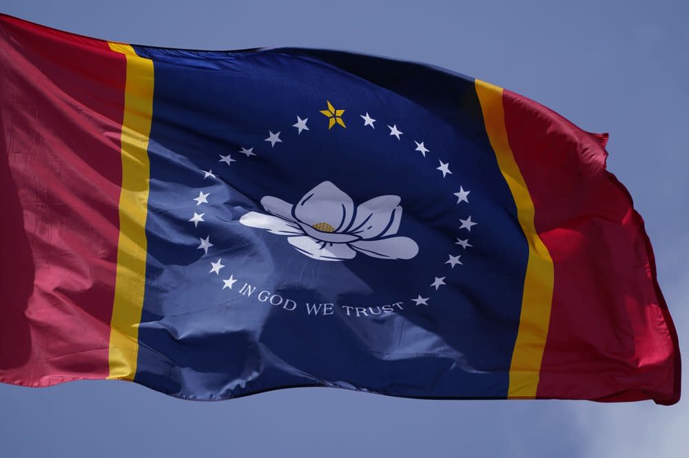 This Sept. 2, 2020, file photo shows the magnolia centered banner chosen by the Mississippi State Flag Commission displayed outside the Old State Capitol Museum in downtown Jackson, Miss. (AP Photo/Rogelio V. Solis, File)