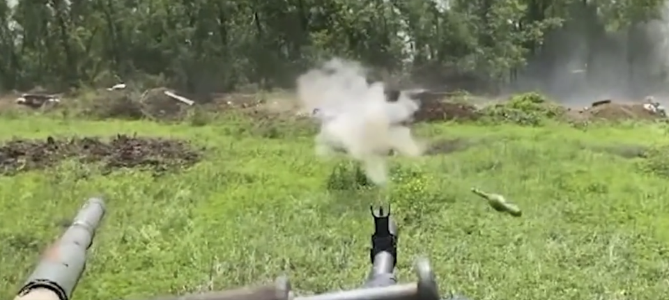 The first of two RPGs fired at a Ukrainian tank narrowly missed. (Twitter screencap)