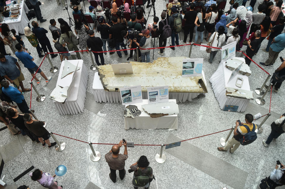 Plane wreckage believed to be from Malaysia Airlines flight MH370 is displayed during an event held by relatives of the passengers and supporters to mark the 10th year since the Boeing 777 aircraft carrying 239 people disappeared from radar screens on March 8, 2014 while en route from Kuala Lumpur to Beijing, in Subang Jaya on March 3, 2024. (Photo by Arif Kartono / AFP) (Photo by ARIF KARTONO/AFP via Getty Images)