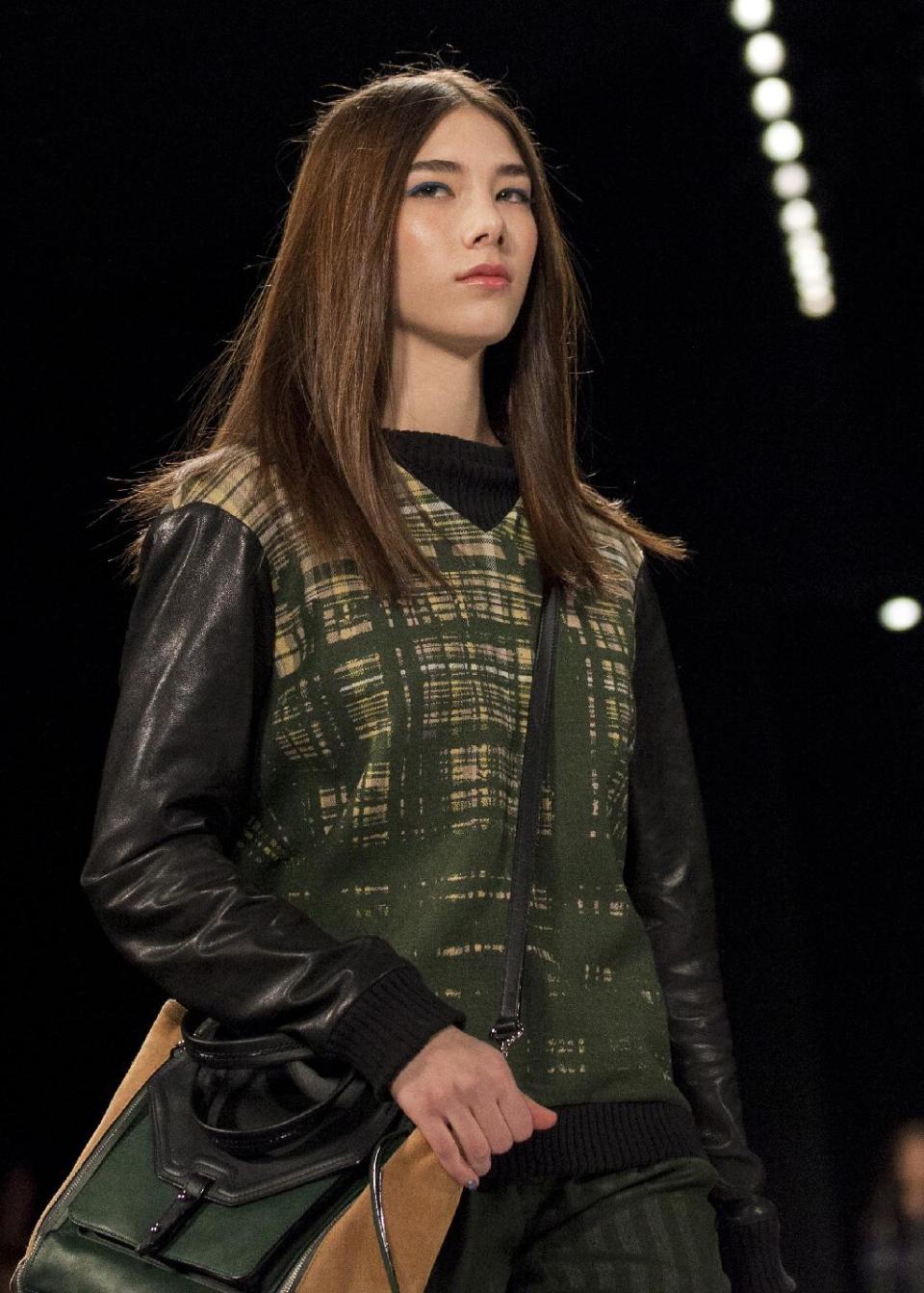 A model walks the runway during the Rebecca Minkoff Fall 2013 fashion show during Fashion Week, Friday, Feb. 8, 2013, in New York. (AP Photo/Karly Domb Sadof)