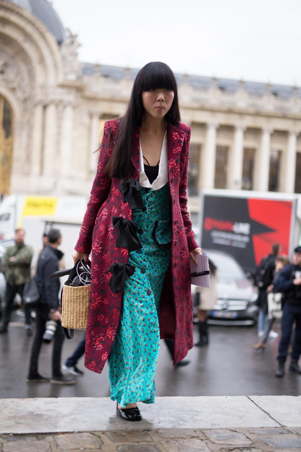 Show off your print-mixing talent by layering a bright patterned coat over a graphic dress in a contrasting color.