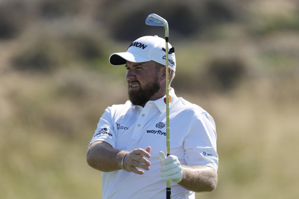 Shane Lowry of Ireland follows his ball on the 1st hole during the third round of Abu Dhabi HSBC Golf Championship, in Abu Dhabi, United Arab Emirates, Saturday, Jan. 21, 2023. (AP Photo/Kamran Jebreili)