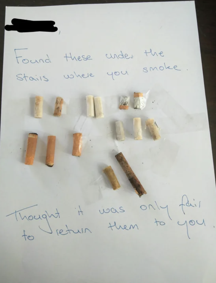 A note with cigarette butts taped to it