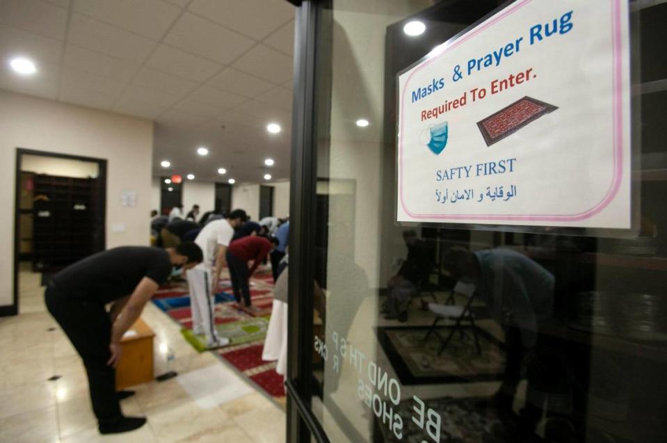 Muslims pray on the evening of Saturday, May 8, at the Islamic Center of Johnson County during Ramadan in Overland Park. Safety procedures including social distancing and temperature checks were in place. The event was not held last year due to the pandemic.