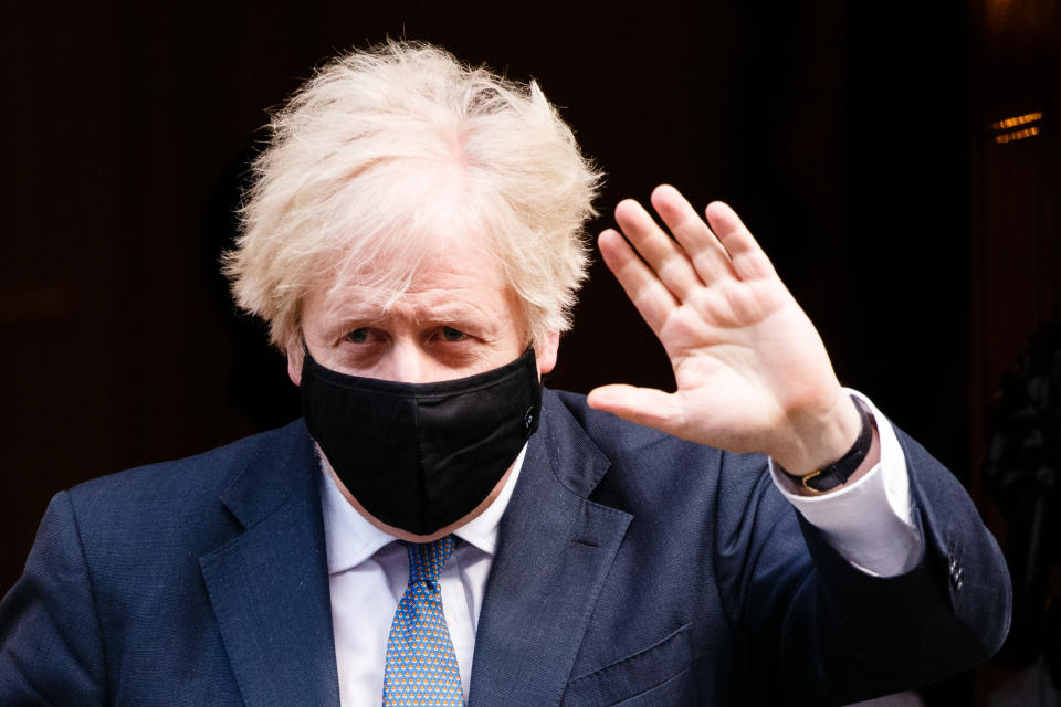 British Prime Minister Boris Johnson, Conservative Party leader and MP for Uxbridge and South Ruislip, wears a face mask leaving 10 Downing Street to head to Parliament in London, England, on January 6, 2021. MPs vote today on whether to approve the England-wide coronavirus lockdown announced by the prime minister on Monday night. (Photo by David Cliff/NurPhoto via Getty Images)