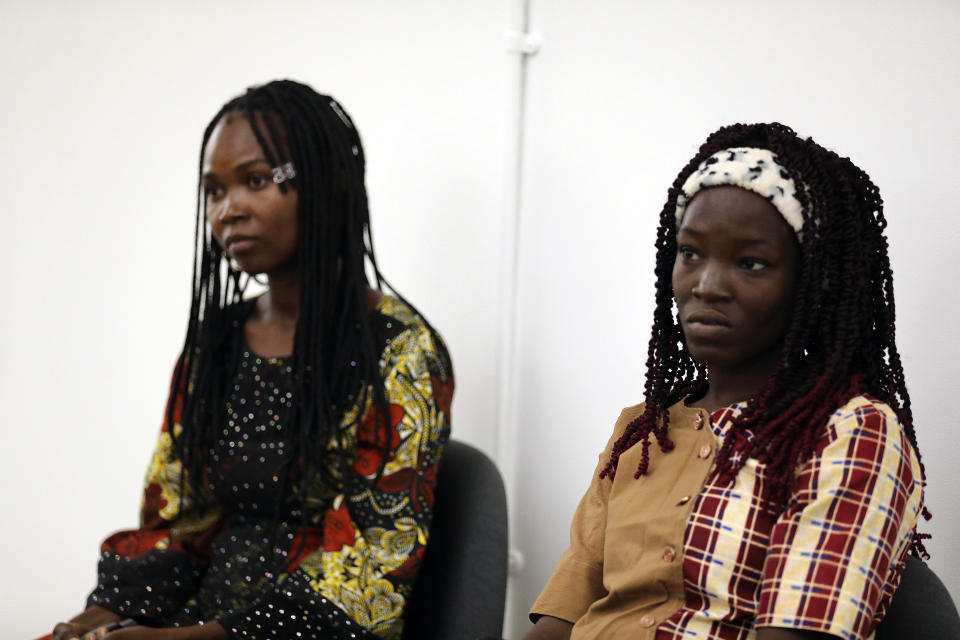 FILE- Jummai Mutah, left, and Amina Ali, Chibok schoolgirls who were kidnapped in 2014 by Islamic extremists and later released, attend a 10th anniversary event of the abduction in Lagos, Nigeria, Thursday, April 4, 2024. Their experience represents a worrying new development in Nigeria, Africa's most populous country where the mass abduction of Chibok schoolgirls a decade ago marked a new era of fear even as nearly 100 of the girls remain in captivity. An array of armed groups now focus on abducting schoolchildren, seeing in them a lucrative way to fund other crimes and control villages in the nation's mineral-rich but poorly-policed northwestern region. (AP Photo/Mansur Ibrahim, File )