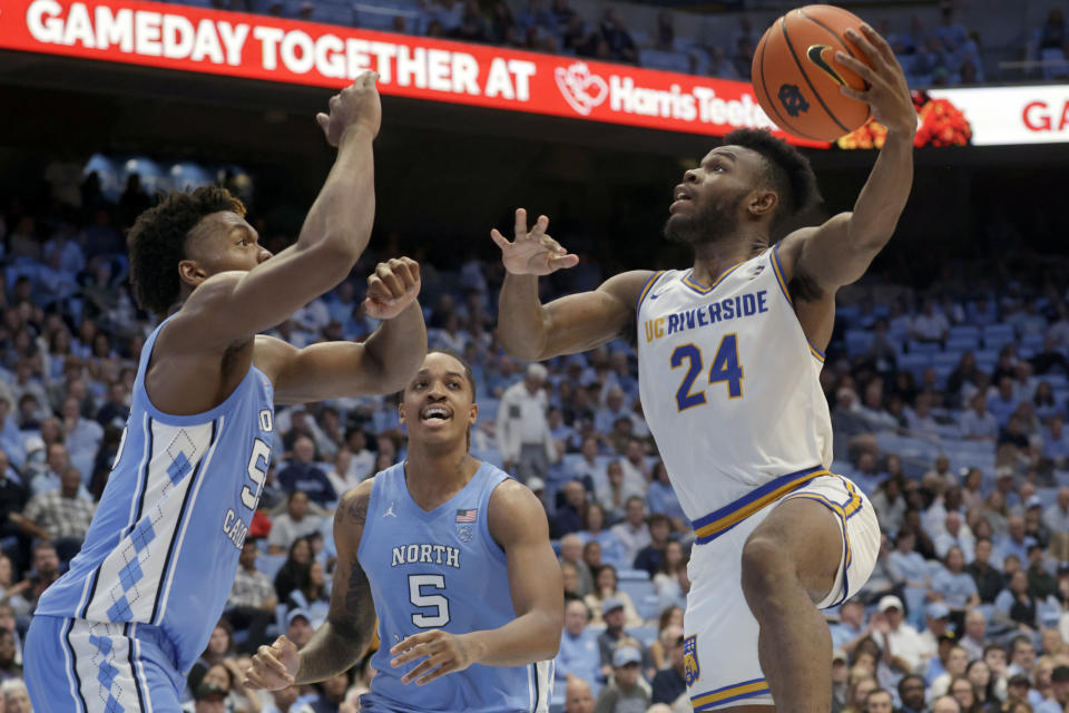 UC Riverside guard Barrington Hargress (24) drives against North Carolina forwards Harrison Ingram, left, and Armando Bacot (5) during the second half of an NCAA college basketball game against North Carolina, Friday, Nov. 17, 2023, in Chapel Hill, N.C. (AP Photo/Chris Seward)