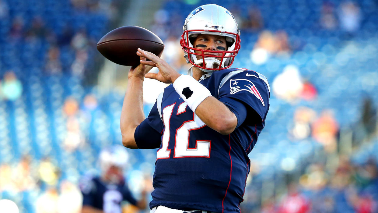 FOXBORO, MA - AUGUST 13:  Tom Brady #12 of the New England Patriots warms up prior to a preseason game against the Green Bay Packers at Gillette Stadium on August 13, 2015 in Foxboro, Massachusetts.