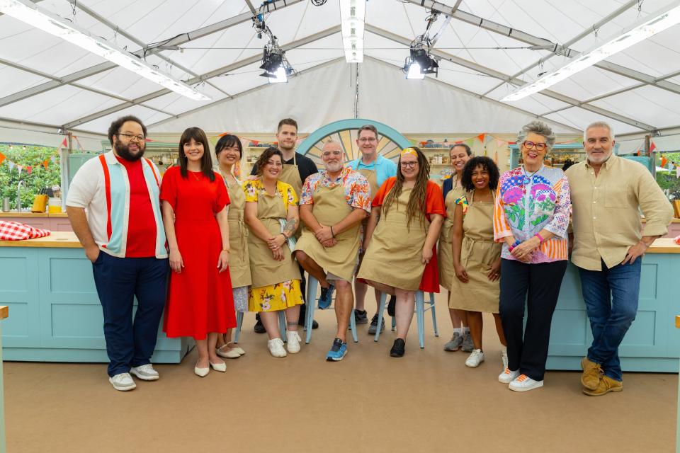 Brad Gessner, at center in back wearing a light blue shirt, is a contestant on Season 2 of "The Great American Baking Show." The competitors and judges were photographed in the show's tent located outside London. The show premieres Friday on The Roku Channel.
