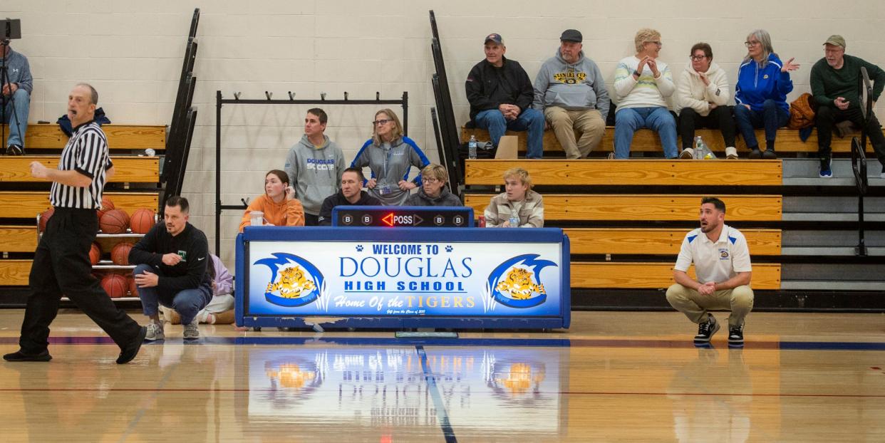 Nipmuc High School Head Boys Basketball Coach Jason Gosselin, left, and his brother, Douglas Head Coach Chad Gosselin, during the game at Douglas High School, where they both also went to school as students, Jan. 3, 2024.