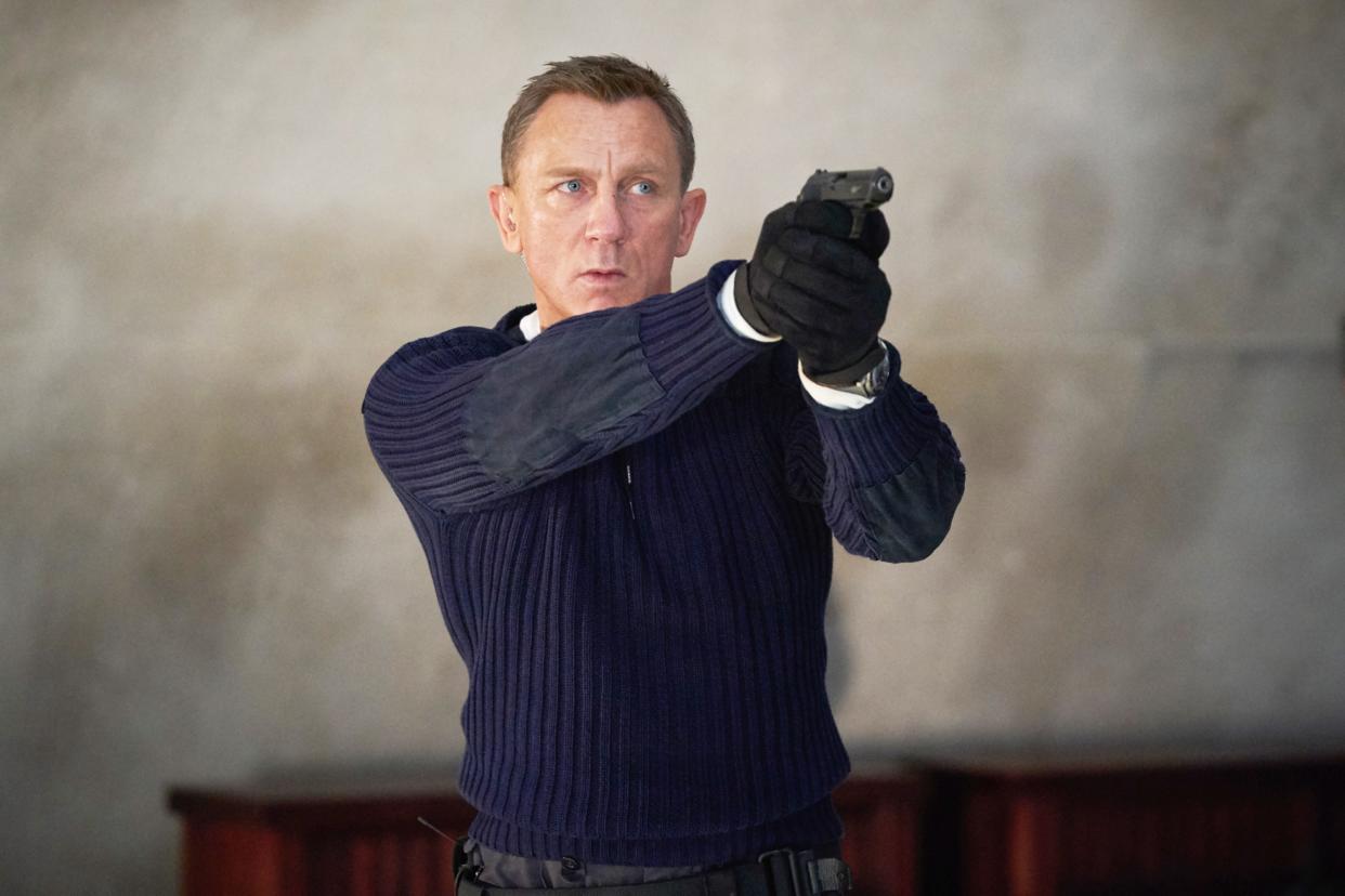 Daniel Craig takes aim in his final outing as James Bond in No Time to Die. (MGM/Courtesy Everett Collection)
