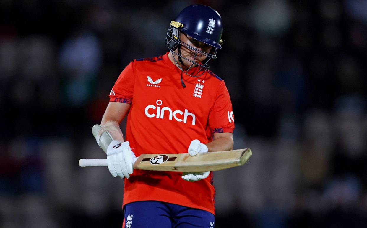 England's Sam Curran looks dejected after losing his wicket to Australia's Adam Zampa