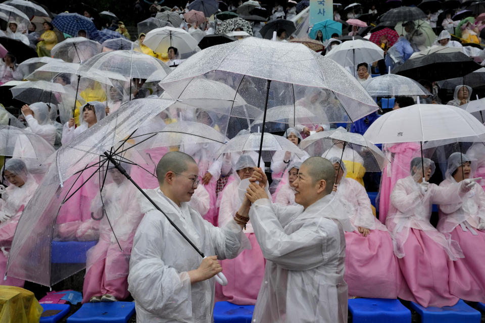 Buddhist monks wait for a lantern parade ahead of the upcoming birthday of Buddha at Dongguk University in Seoul, South Korea, Saturday, May 11, 2024. (AP Photo/Ahn Young-joon)