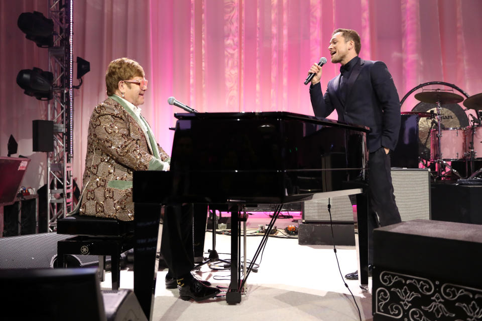 Elton John and Taron Egerton sang a delightful surprise duet of “Tiny Dancer” Sunday night. (Photo: Getty Images for EJAF)