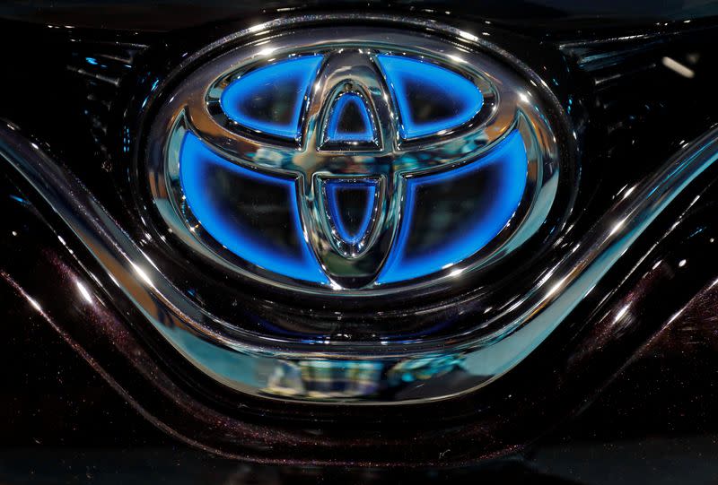 FILE PHOTO: The Toyota logo is seen on the bonnet of a newly launched Camry Hybrid electric vehicle at a hotel in New Delhi