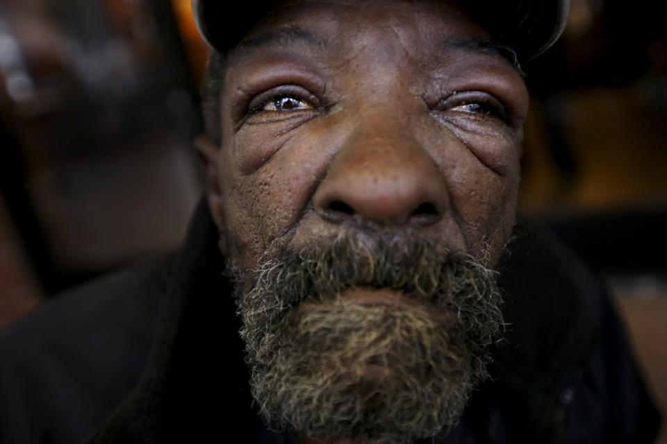 A man with a beard and tears in his eyes