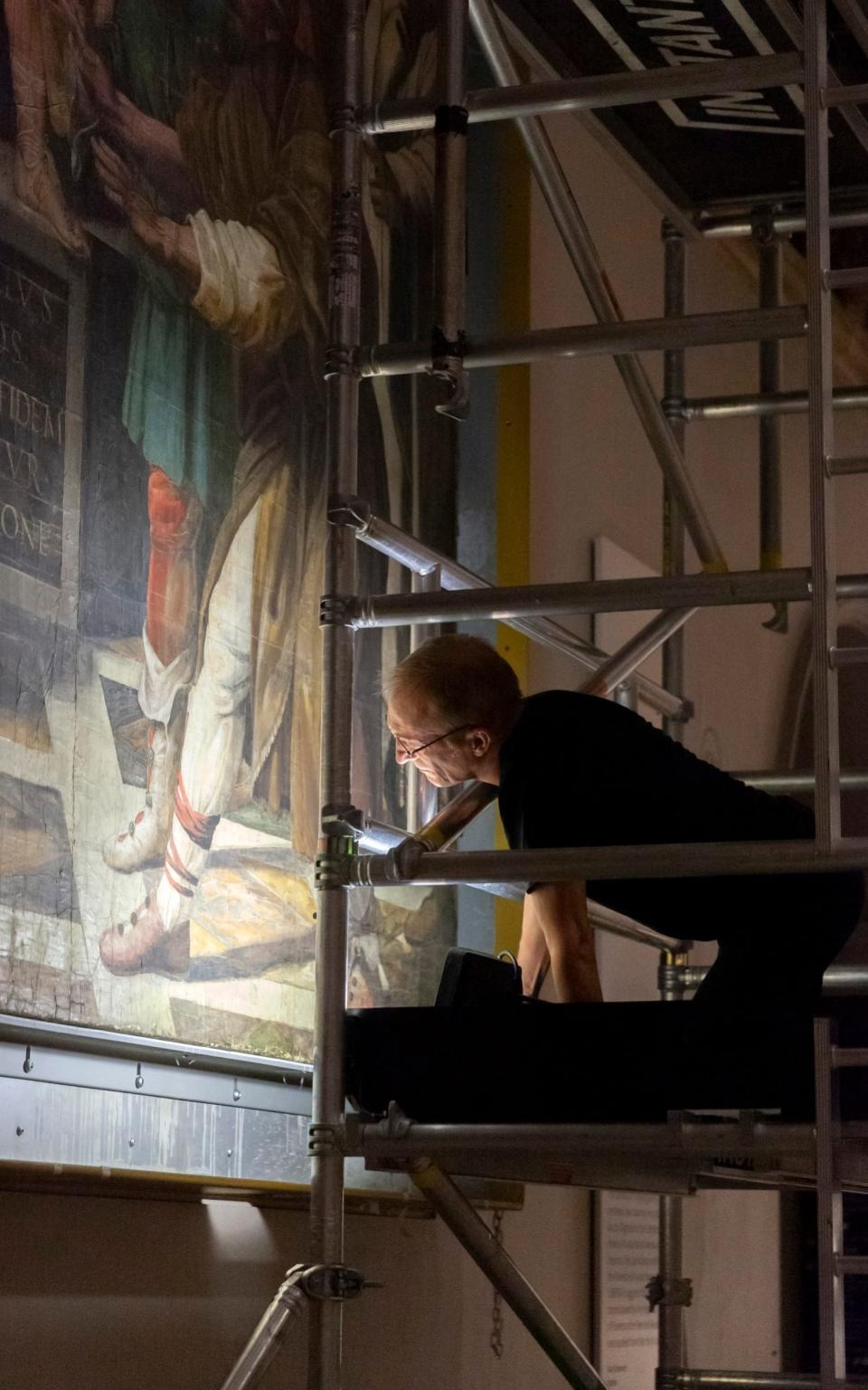 A V&A conservator checks the condition of a Raphael cartoon - VA Photo Studio