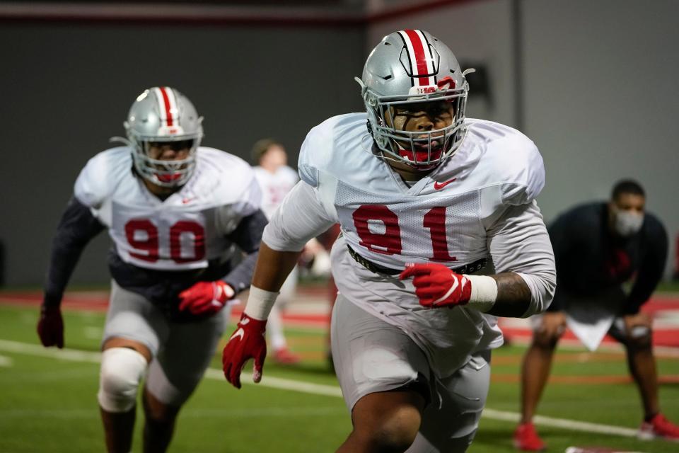 Ohio State's Tyleik Williams (91) says a fitness plan and exercise have helped him drop 40 pounds.