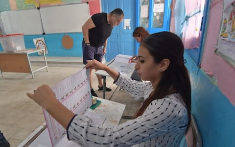 Tunisian voters turned out today to choose from a crowded field of candidates - Credit: FETHI BELAID/AFP/Getty Images