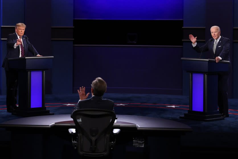 CLEVELAND, OHIO - SEPTEMBER 29: U.S. President Donald Trump and Democratic presidential nominee Joe Biden participate in the first presidential debate moderated by Fox News anchor Chris Wallace (C) at the Health Education Campus of Case Western Reserve University on September 29, 2020 in Cleveland, Ohio. This is the first of three planned debates between the two candidates in the lead up to the election on November 3. (Photo by Scott Olson/Getty Images)