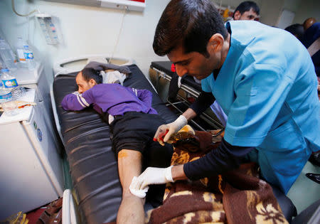 Displaced people who were injured in clashes and fled from Islamic State militants in Mosul, receive treatment at a hospital west of Erbil, Iraq, November 25, 2016. REUTERS/Azad Lashkari