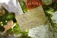 A copy of first lady Jill Biden's apple crisp recipe card decorates a fireplace mantel in the China Room of the White House during a press preview of holiday decorations at the White House, Monday, Nov. 28, 2022, in Washington. (AP Photo/Patrick Semansky)