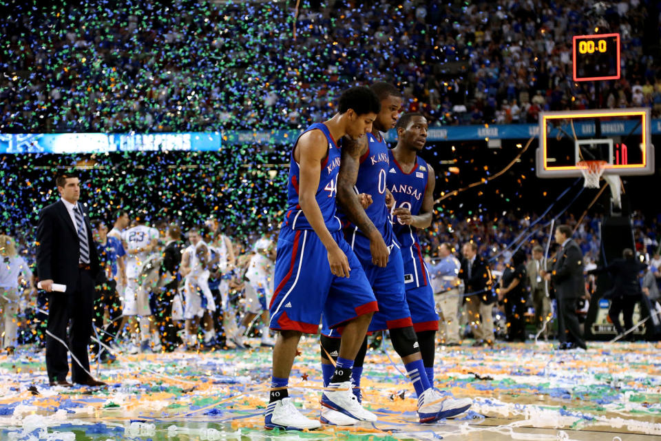 Kevin Young #40, Thomas Robinson #0 and Tyshawn Taylor #10 of the Kansas Jayhawks walk off the court after losing to the Kentucky Wildcats 67-59 in the National Championship Game of the 2012 NCAA Division I Men's Basketball Tournament at the Mercedes-Benz Superdome on April 2, 2012 in New Orleans, Louisiana. (Photo by Ronald Martinez/Getty Images)