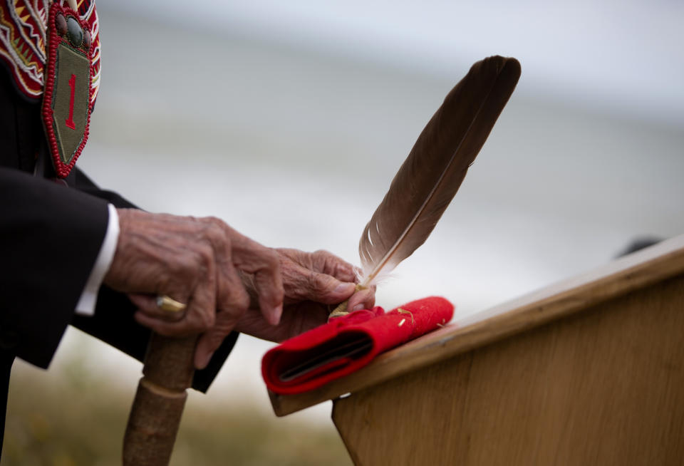 World War II D-Day veteran and Penobscot Elder from Maine, Charles Norman Shay participates in a Native American ceremony at his memorial overlooking Omaha Beach in Saint-Laurent-sur-Mer, Normandy, France, Friday, June 5, 2020. Saturday's anniversary of D-Day will be one of the loneliest remembrances ever, as the coronavirus pandemic is keeping almost everyone away, from government leaders to frail veterans who might not get another chance for a final farewell to their unlucky comrades. (AP Photo/Virginia Mayo)