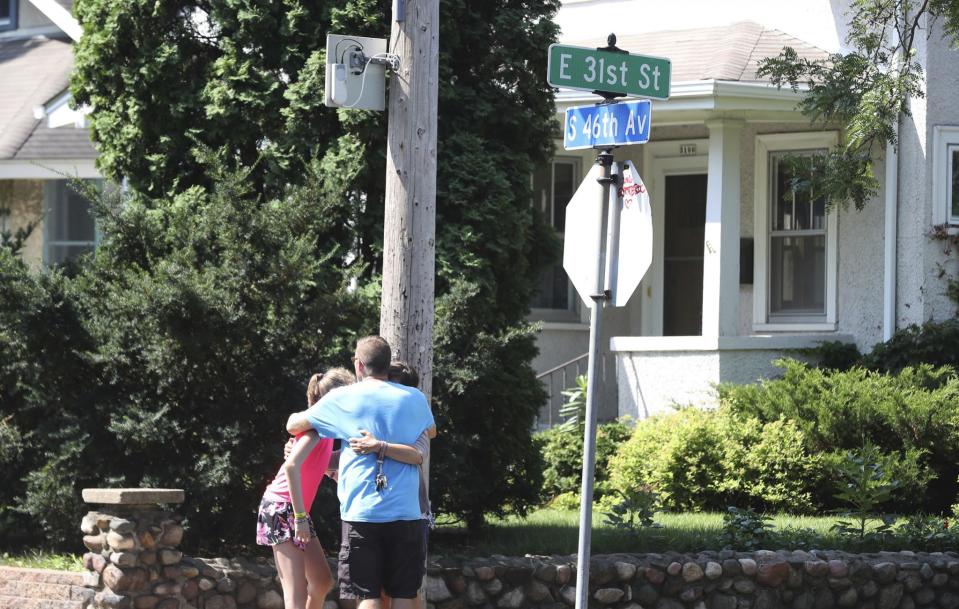 <p>People hug each other near the Minnehaha Academy after an explosion and building collapse at the school in Minneapolis, Minn., on Wednesday, Aug. 2, 2017. The private Christian college prep school serves students from pre-kindergarten through 12th grade. (David Joles/Star Tribune via AP) </p>