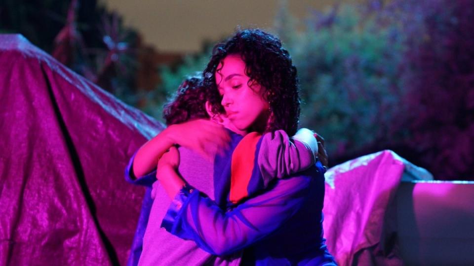 FKA twigs hugs Noah Jupe by a pool