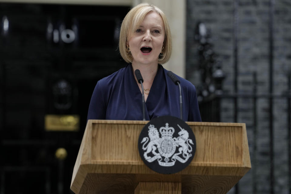 FILE - New British Prime Minister Liz Truss makes an address outside Downing Street in London Tuesday, Sept. 6, 2022 after returning from Balmoral in Scotland where she was formally appointed by Britain's Queen Elizabeth II. Truss says her government will cap domestic energy prices for homes and businesses to ease the cost-of-living crisis. Truss told lawmakers Thursday, Sept. 8, 2022 that the two-year “energy price guarantee” means average household bills will be no more than 2,500 pounds ($2,872) a year for heating and electricity. (AP Photo/Kirsty Wigglesworth, File)