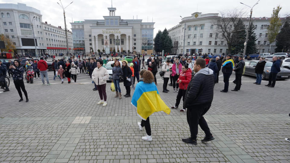 Residents celebrate after Russian forces evacuated Kherson, Ukraine (Aexei Sandakov)