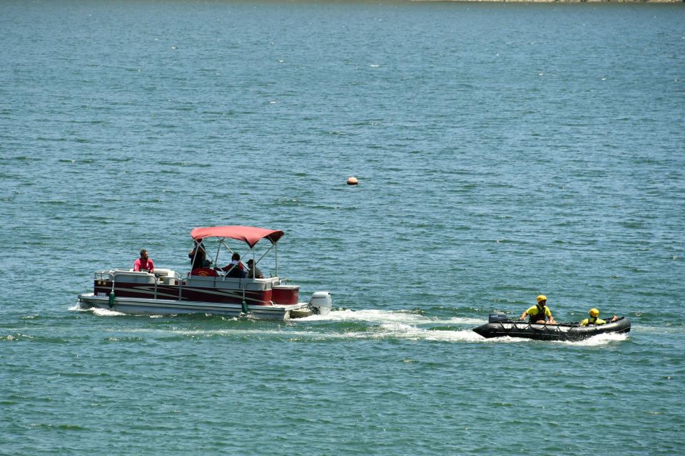 PIRU, CALIFORNIA - JULY 09:  Boats with emergency workers search Lake Piru, where actress Naya Rivera was reported missing Wednesday, on July 9, 2020 in Piru, California. Rivera, known for her role in "Glee," was reported missing July 8 after her four-year-old son, Josey, was found alone in a boat rented by Rivera. The Ventura County Sheriff’s Department is coordinating a search and recovery operation. (Photo by Amy Sussman/Getty Images)