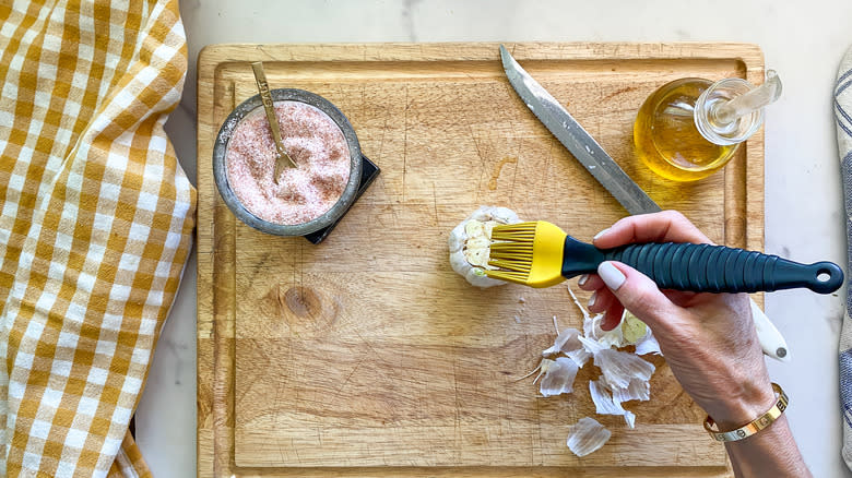 brushing garlic with oil
