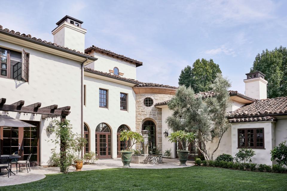 The Spanish Colonial home, built by Brent Hanratty of BHC, is 10,000 square feet and boasts six bedrooms and seven bathrooms. The backyard is home to an army of fruit trees, including lemon, pomegranate, orange, and avocado. Landscaping was done by Jonathan Pedersen of Monrovia Nursery Company.