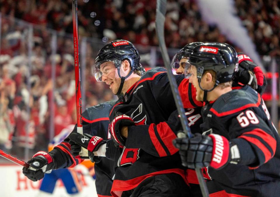 Carolina Hurricanes left wing <a class="link " href="https://sports.yahoo.com/nhl/players/7900/" data-i13n="sec:content-canvas;subsec:anchor_text;elm:context_link" data-ylk="slk:Andrei Svechnikov;sec:content-canvas;subsec:anchor_text;elm:context_link;itc:0">Andrei Svechnikov</a> (37) is surrounded by teammates after scoring against New York Islander goalie <a class="link " href="https://sports.yahoo.com/nhl/players/4003/" data-i13n="sec:content-canvas;subsec:anchor_text;elm:context_link" data-ylk="slk:Semyon Varlamov;sec:content-canvas;subsec:anchor_text;elm:context_link;itc:0">Semyon Varlamov</a> (40) in the first period during Game 5 of the NHL Eastern Conference quarterfinals agains the New York Islanders on Tuesday, April 30, 2024 at PNC Arena, in Raleigh N.C. Robert Willett/rwillett@newsobserver.com