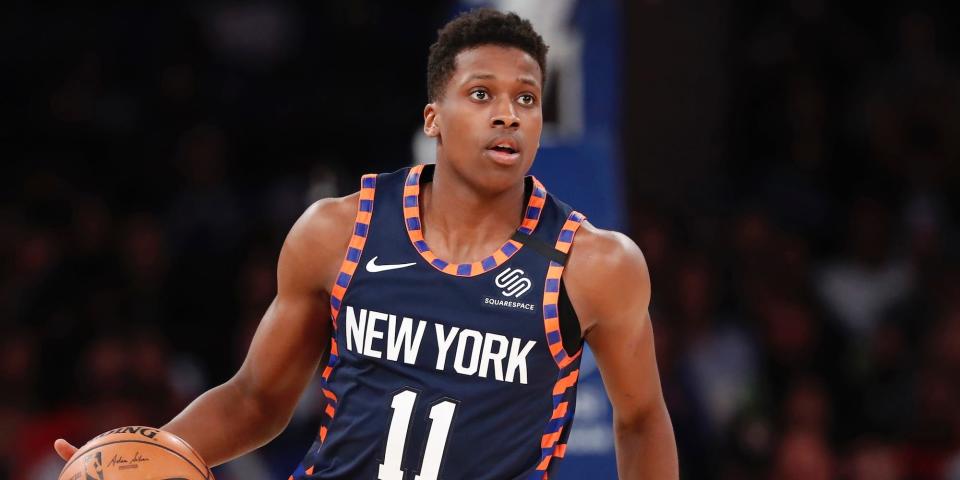 Frank Ntilikina looks up while dribbling the ball