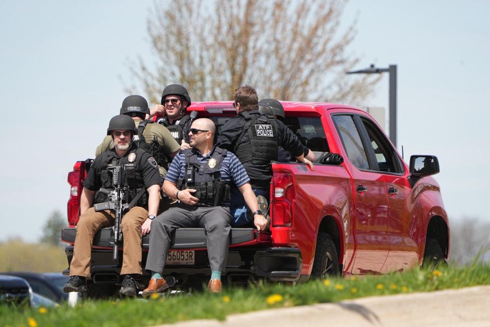 Law enforcement officers ride away from the school in Mount Horeb, Wisconsin on Wednesday, May 1, 2024.