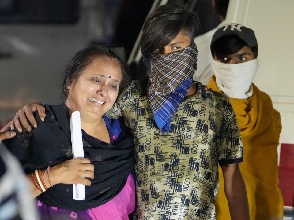 Relatives of a victim mourn after a cable bridge across the Machchu river collapsed