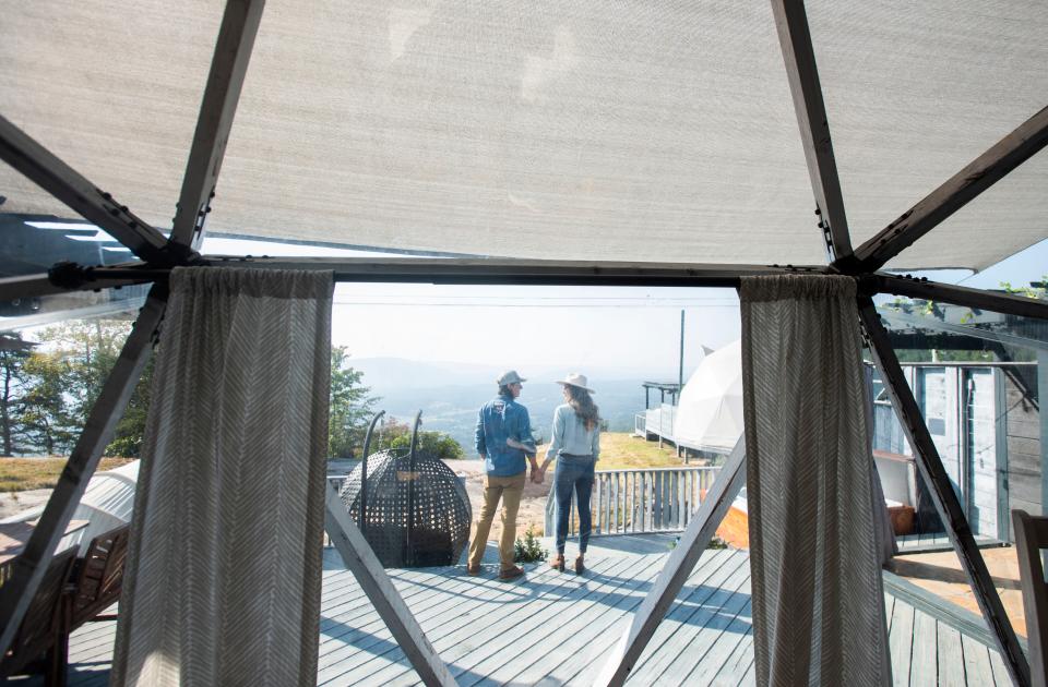 Bolt Farm Treehouse owners Seth and Tori Bolt, seen here on Sep 22, 2022, have recently added mirrored cabins to their 55-acre nature retreat atop Whitwell Mountain in Whitwell, Tennessee. The mirrored cabins are the first of their kind in the United States. 