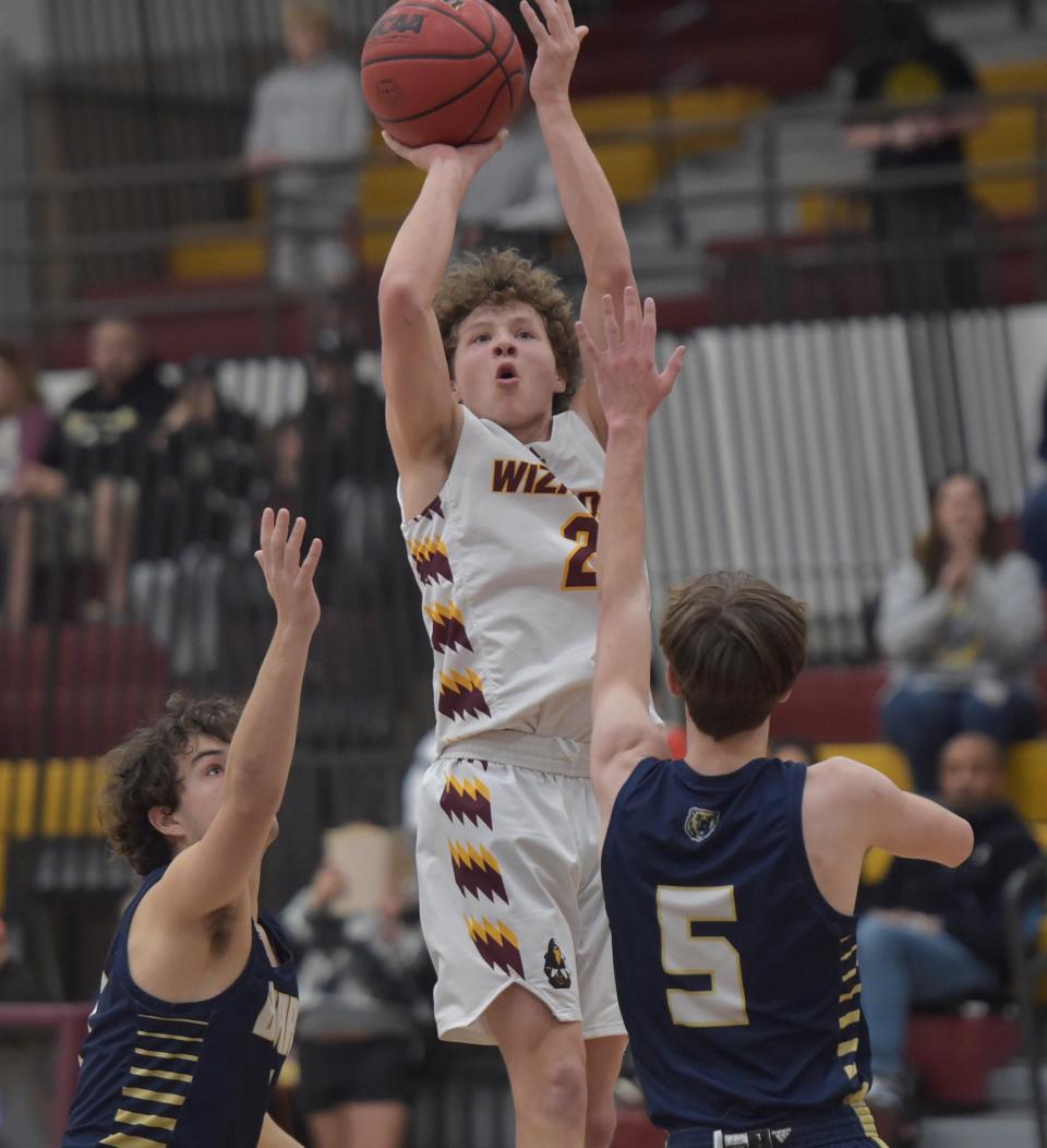 Windsor High School boys basketball player Tanner Garcia leaps high into the air while putting up a shot during a Class 4A playoff game against visiting Palmer Ridge on Saturday in Windsor.