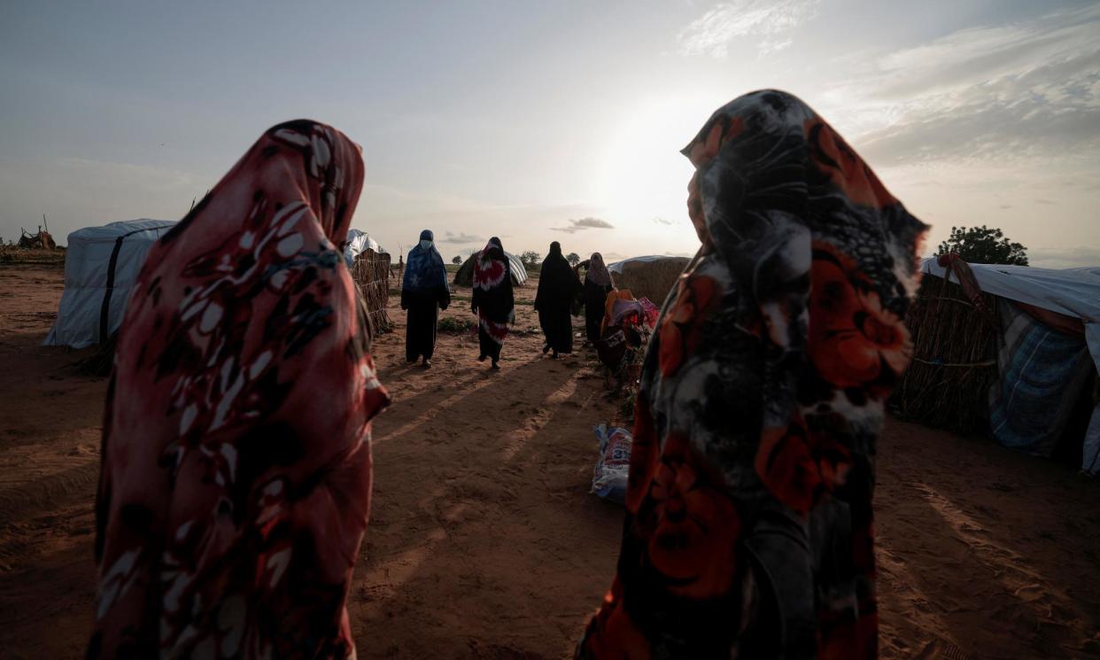 <span>Survivors of sexual violence who fled the conflict in Geneina get together outside their makeshift shelters in Adré last year.</span><span>Photograph: Zohra Bensemra/Reuters</span>