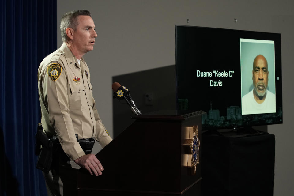 CAPTION CORRECTION: CORRECTS SPELLING OF NAME: Las Vegas police Lt. Jason Johansson of the Homicide Section speaks beside a photo of Duane "Keffe D" Davis during a news conference on an indictment in the 1996 murder of rapper Tupac Shakur, Friday, Sept. 29, 2023, in Las Vegas. The screen in rear have name misspelled. (AP Photo/John Locher)