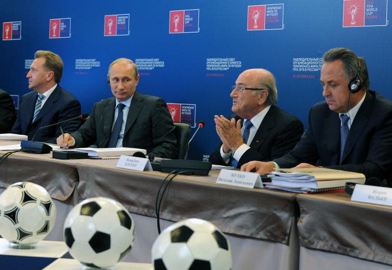 FIFA President Sepp Blatter (2nd R) speaks as Russian President Vladimir Putin (2nd L), First Vice Premier Igor Shuvalov (L) and Sports Minister Vitaly Mutko attend a council "Russia 2018" in Moscow on October 28, 2014