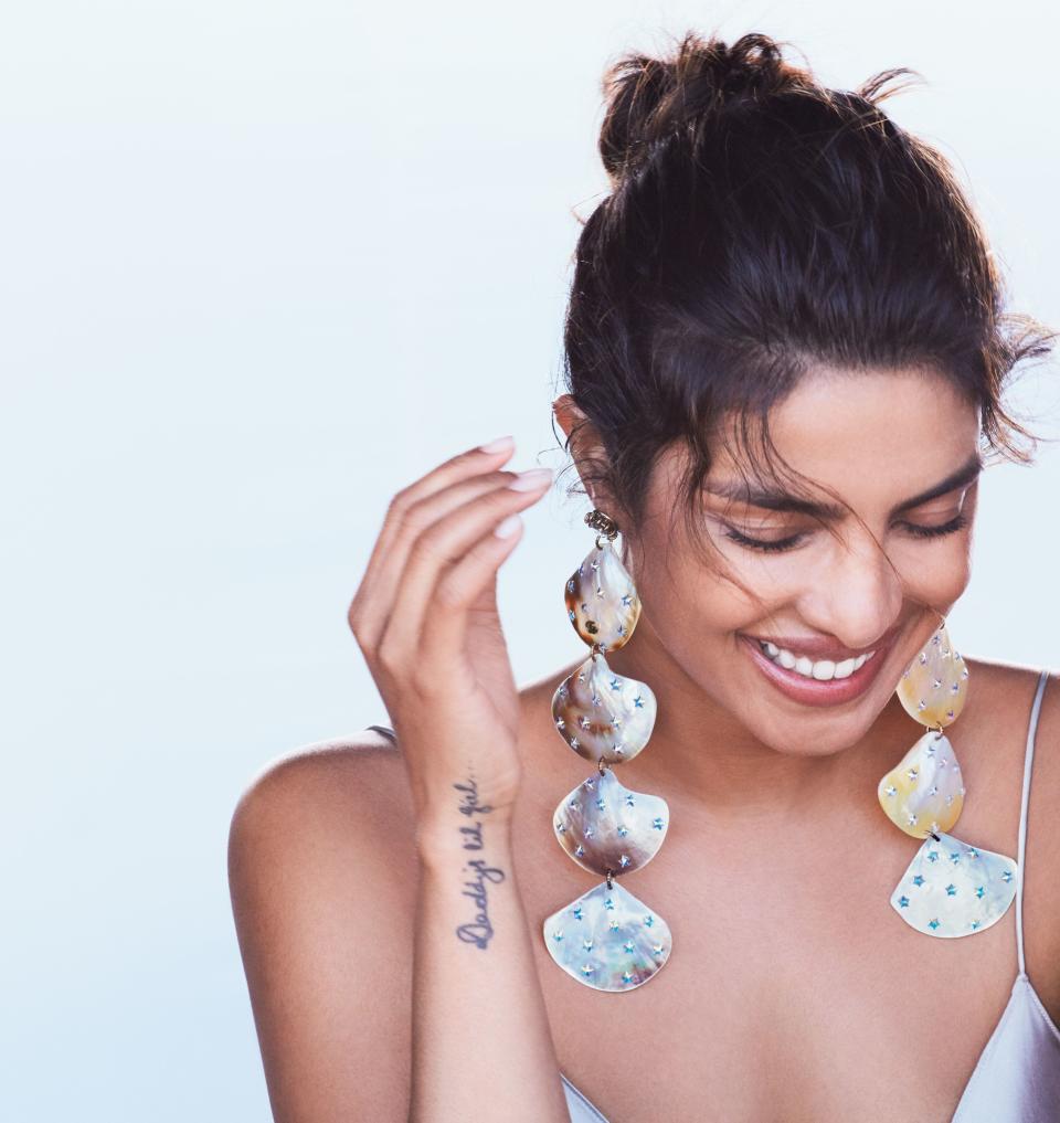 Heavy is the head that wears the crown—or, in this case, a pair of crystal and mother-of-pearl encrusted shoulder-dusting Gucci earrings. For Chopra, though, the weight that comes with a high-profile life in Hollywood is just the start of it.