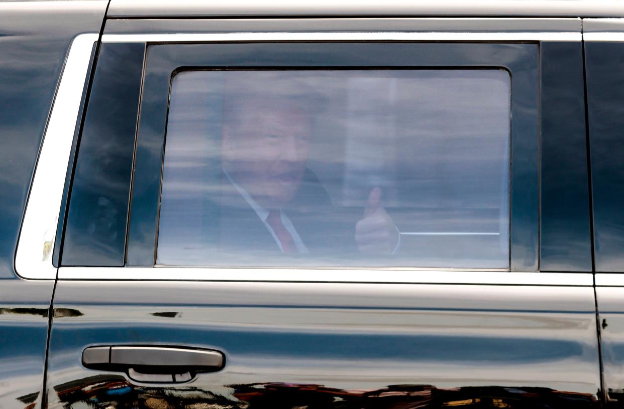 US former president Donald Trump gives a thumbs up from his car as he arrives to Trump National Doral Miami golf course the day before his scheduled federal court appearance in Doral, Florida, USA, 12 June 2023 (EPA)