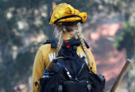 Firefighter Asha Whipple from the Woodland Fire Department prepares to look for hotspots during the Soberanes Fire in the mountains above Carmel Highlands, California, U.S. July 28, 2016. REUTERS/Michael Fiala